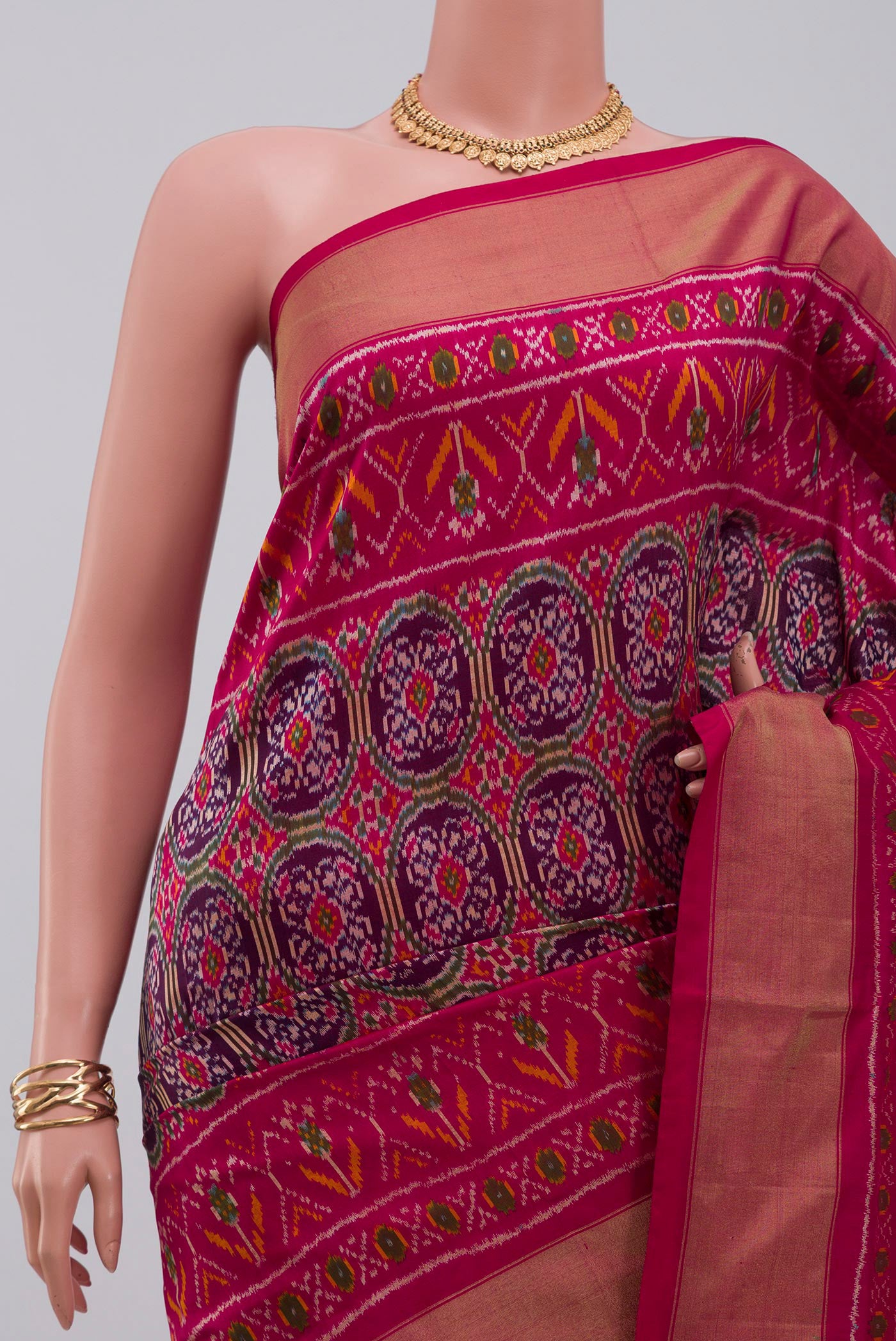 Border image of Purple Pochampally Silk Saree with Ikat design on the body and Zari Border. 
