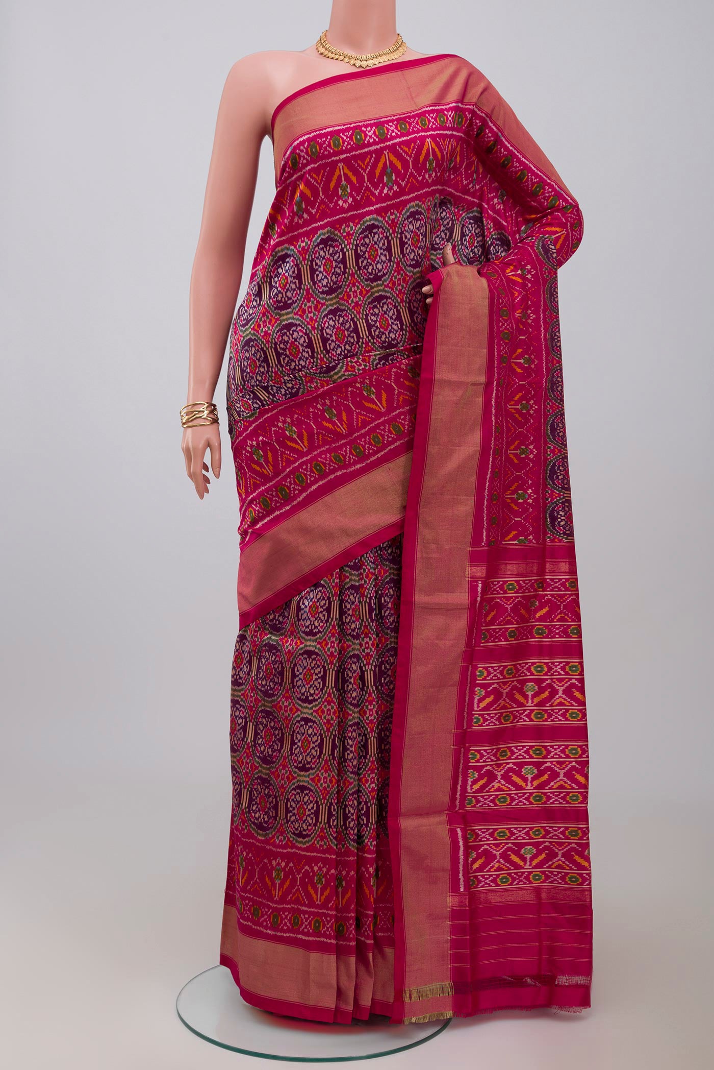 Purple Pochampally Silk Saree with Ikat design on the body and Zari Border.  displayed on a mannequin
