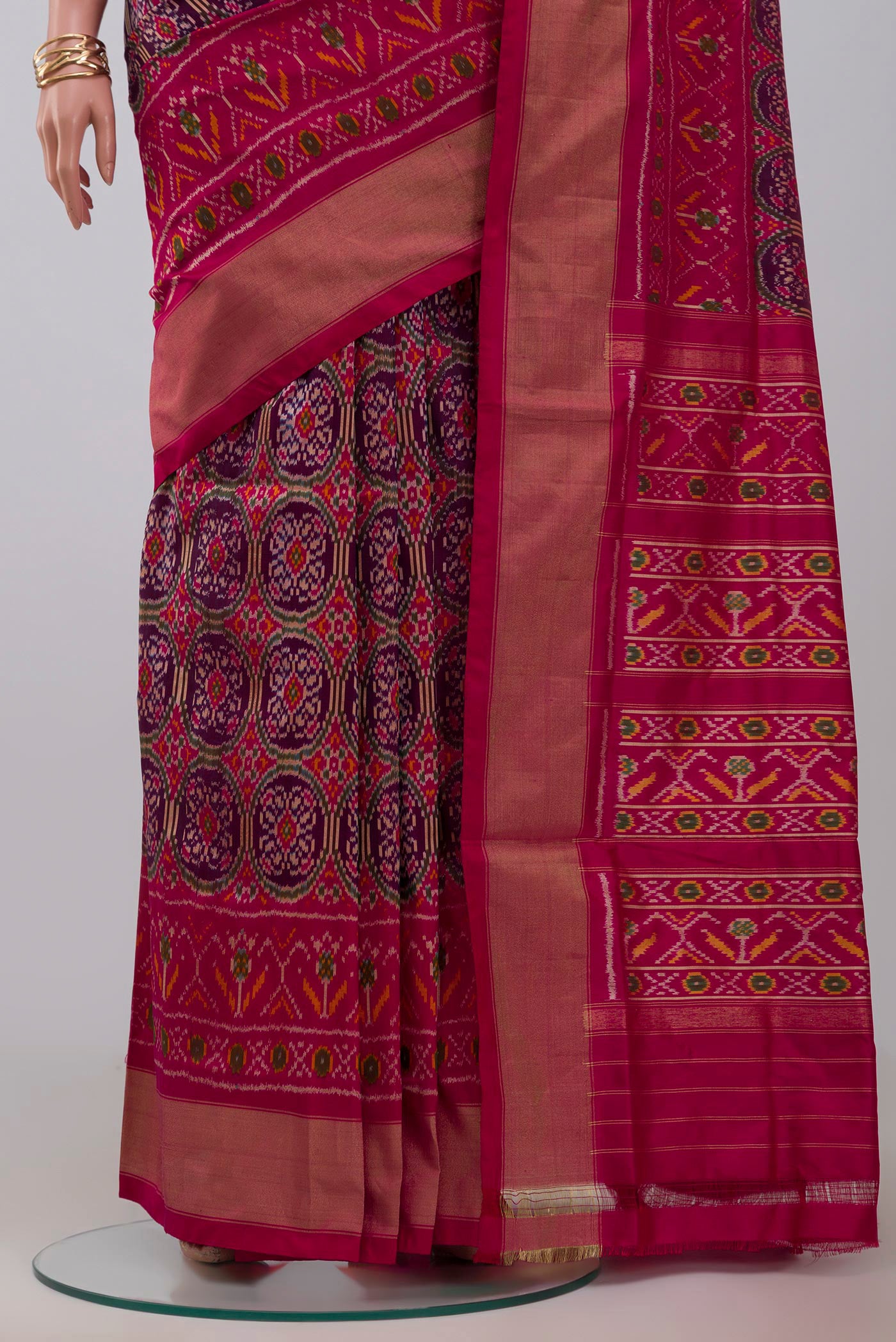 Pleats and pallu of Purple Pochampally Silk Saree with Ikat design on the body and Zari Border. 