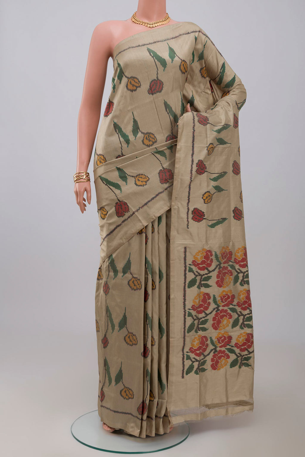 Beige Pochampally Silk Saree with Ikat design on the body and Without Border.  displayed on a mannequin