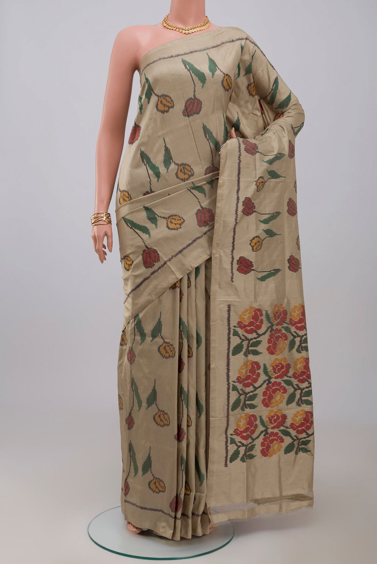 Beige Pochampally Silk Saree with Ikat design on the body and Without Border.  displayed on a mannequin