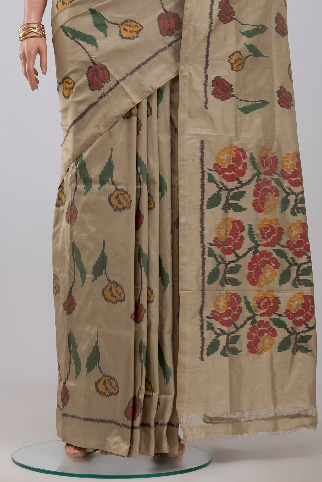 Pleats and pallu of Beige Pochampally Silk Saree with Ikat design on the body and Without Border. 