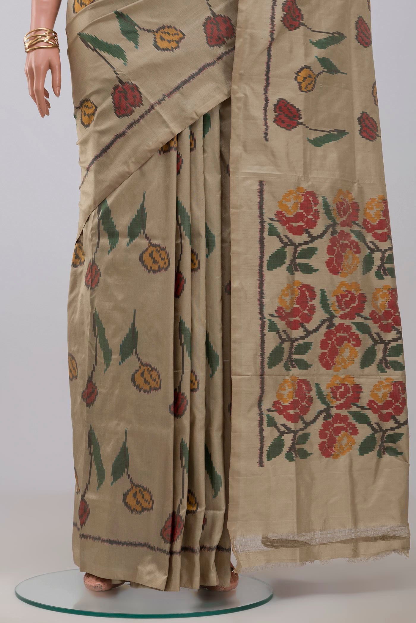 Pleats and pallu of Beige Pochampally Silk Saree with Ikat design on the body and Without Border. 