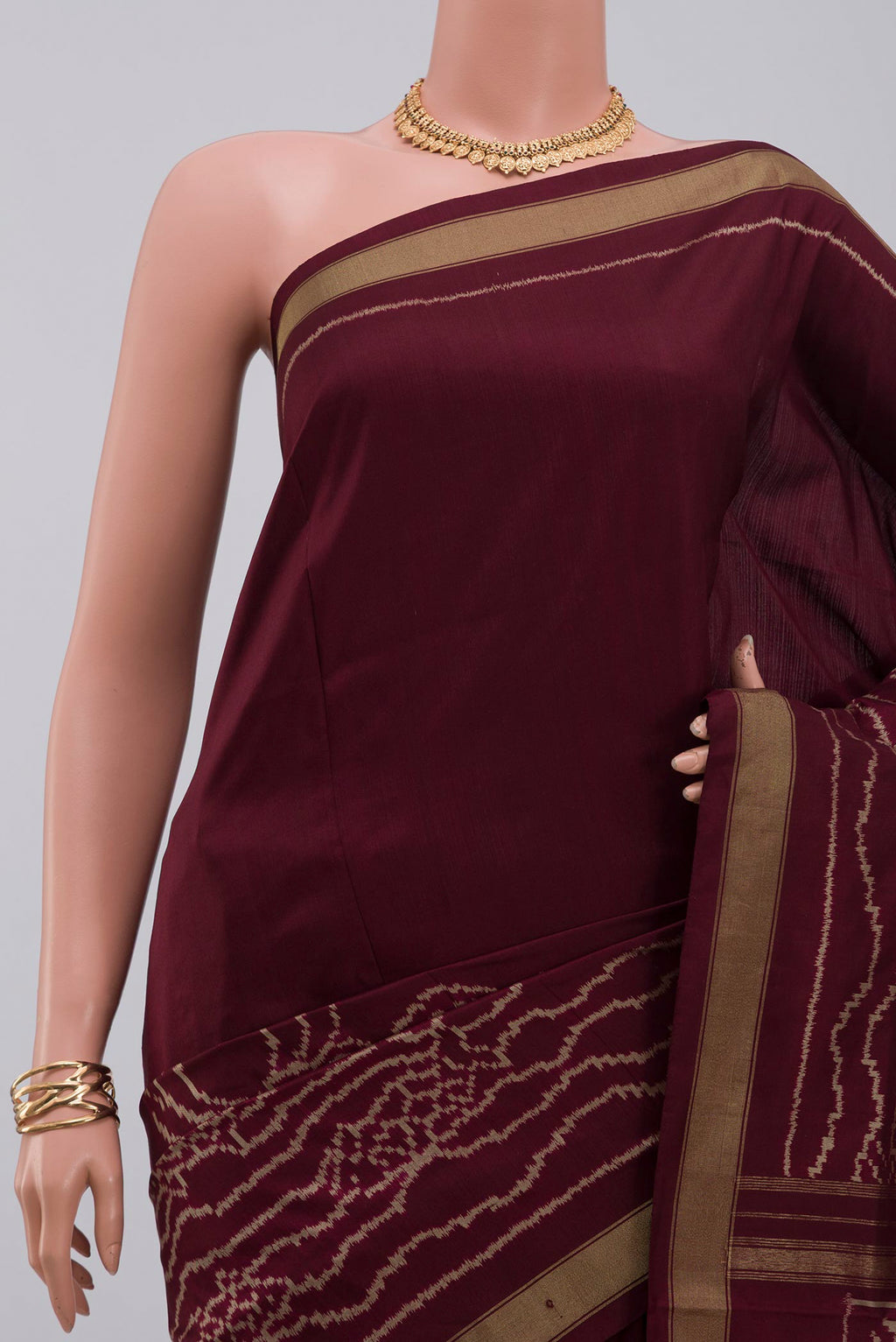 Border image of Brown Pochampally Silk Saree with Ikat design on the body and Zari Border. 