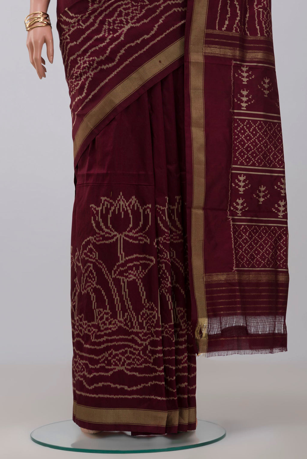 Pleats and pallu of Brown Pochampally Silk Saree with Ikat design on the body and Zari Border. 