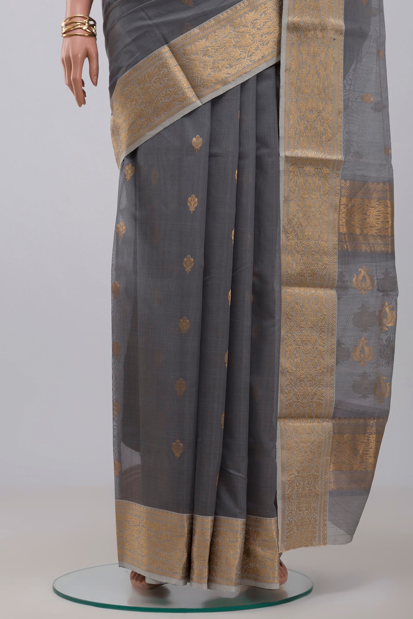 Pleats and pallu of Grey Chanderi Silk Cotton Saree with Zari Butta on the body and Zari Border. 