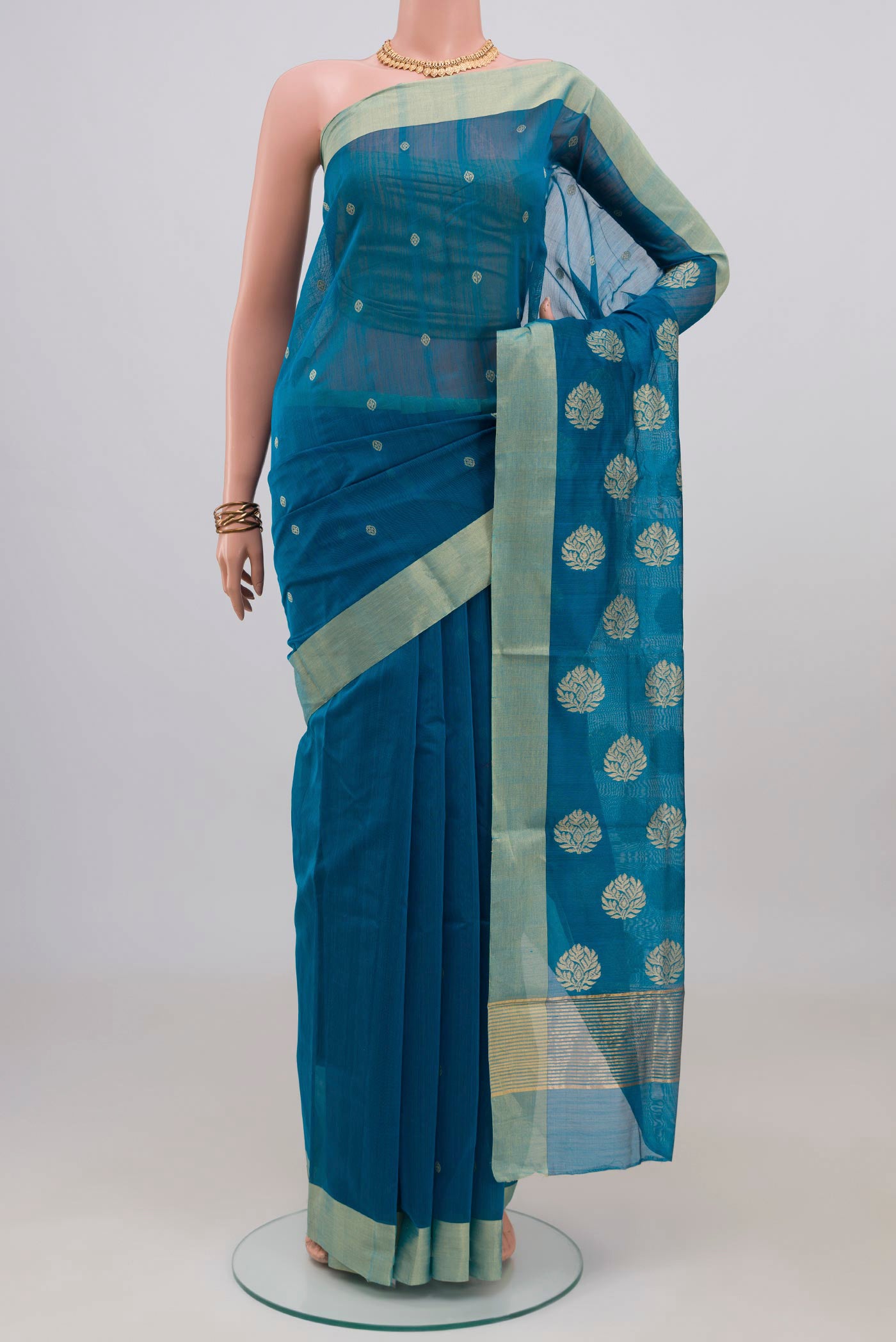Blue Chanderi Silk Cotton Saree with Zari Butta on the body and Zari Border.  displayed on a mannequin