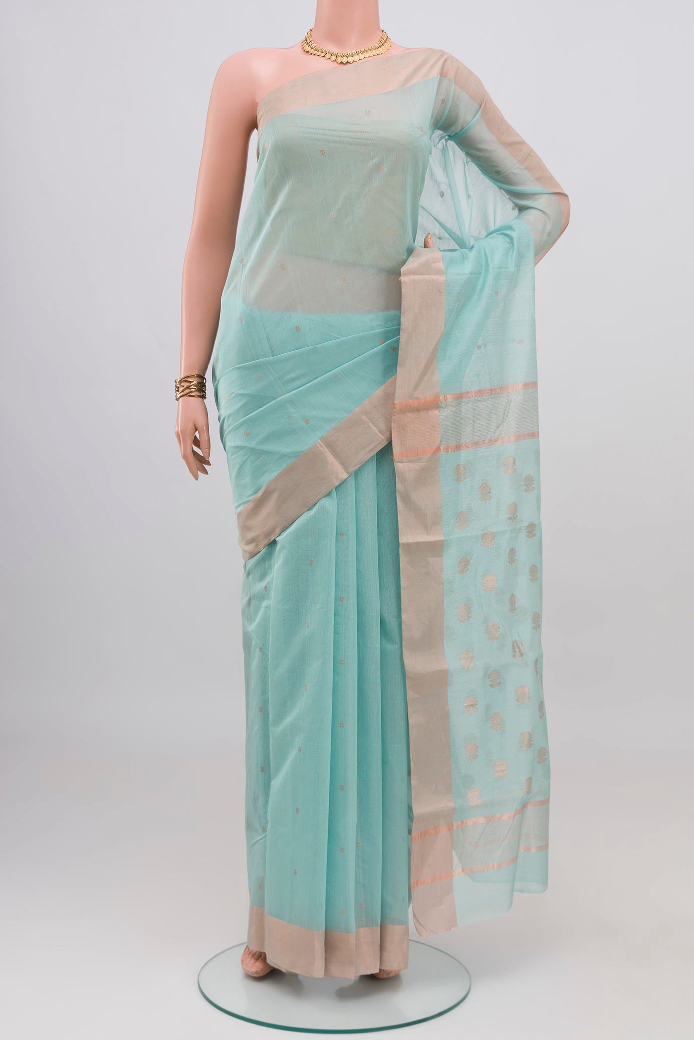 Light Blue Chanderi Silk Cotton Saree with Zari Butta on the body and Zari Border.  displayed on a mannequin