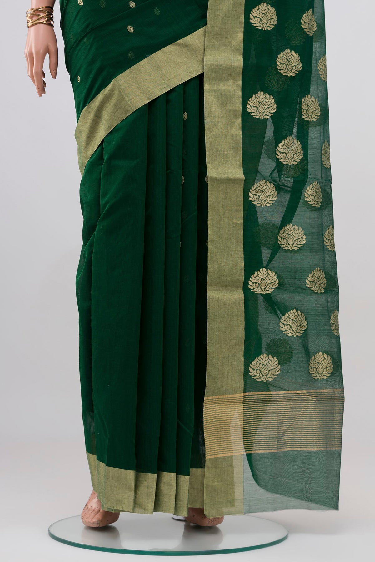 Pleats and pallu of Bottle Green Chanderi Silk Cotton Saree with Zari Butta on the body and Zari Border. 