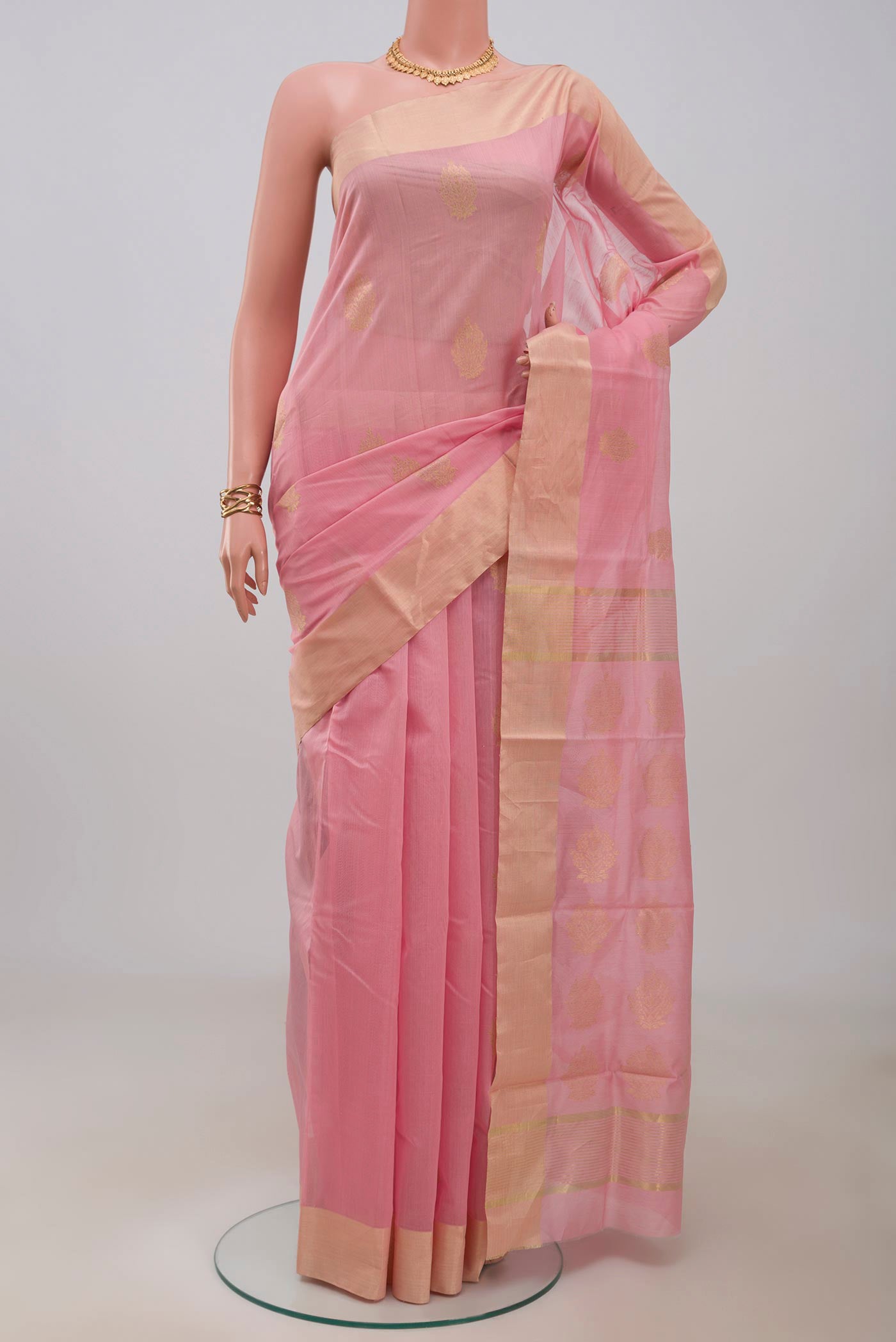 Rose pink Chanderi Silk Cotton Saree with Zari Butta on the body and Zari Border.  displayed on a mannequin