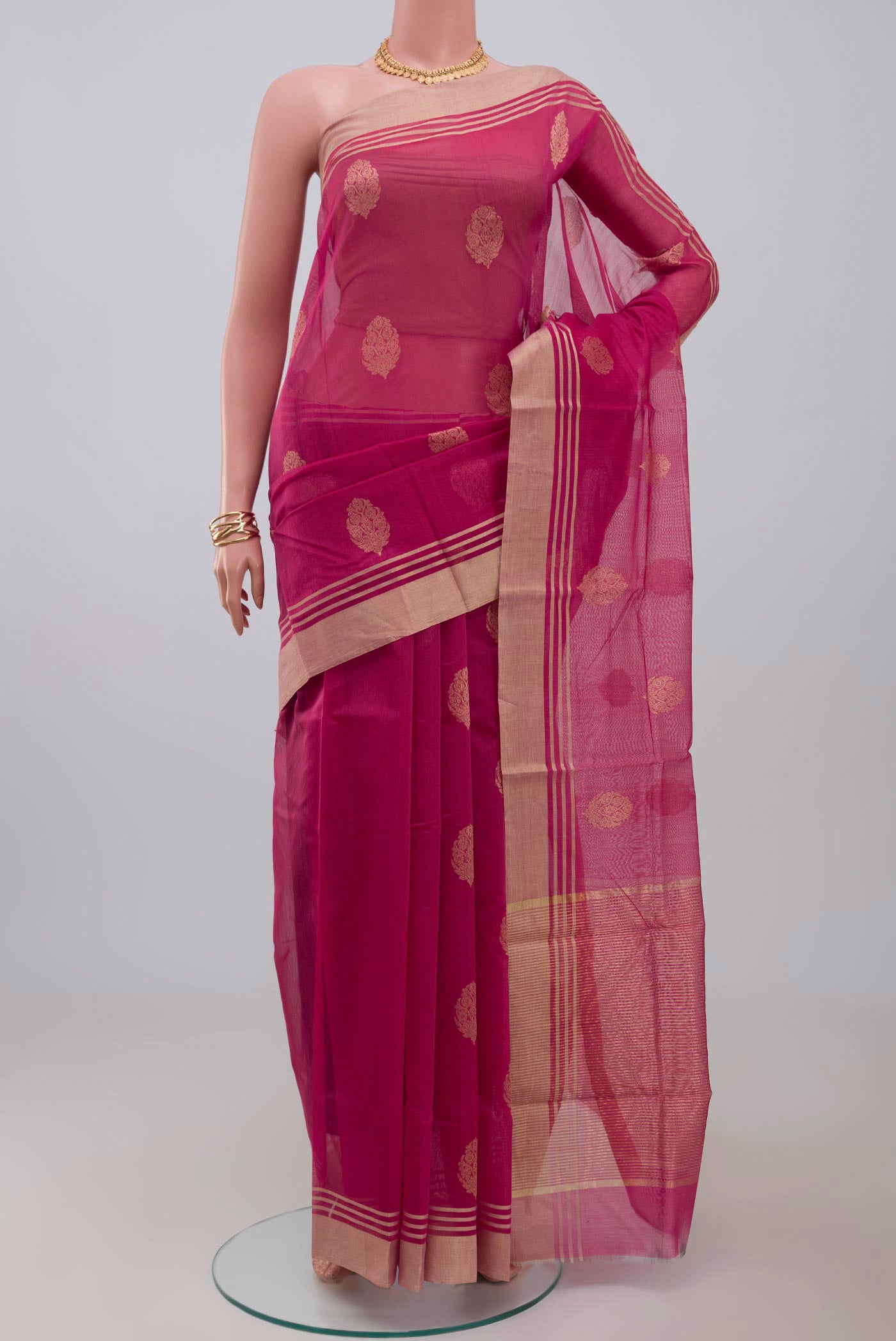 Pink Chanderi Silk Cotton Saree with Zari Butta on the body and Zari Border.  displayed on a mannequin