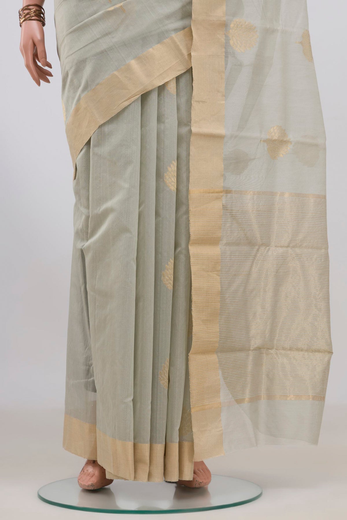 Pleats and pallu of Grey Chanderi Cotton Saree with Zari Butta on the body and Zari Border. 