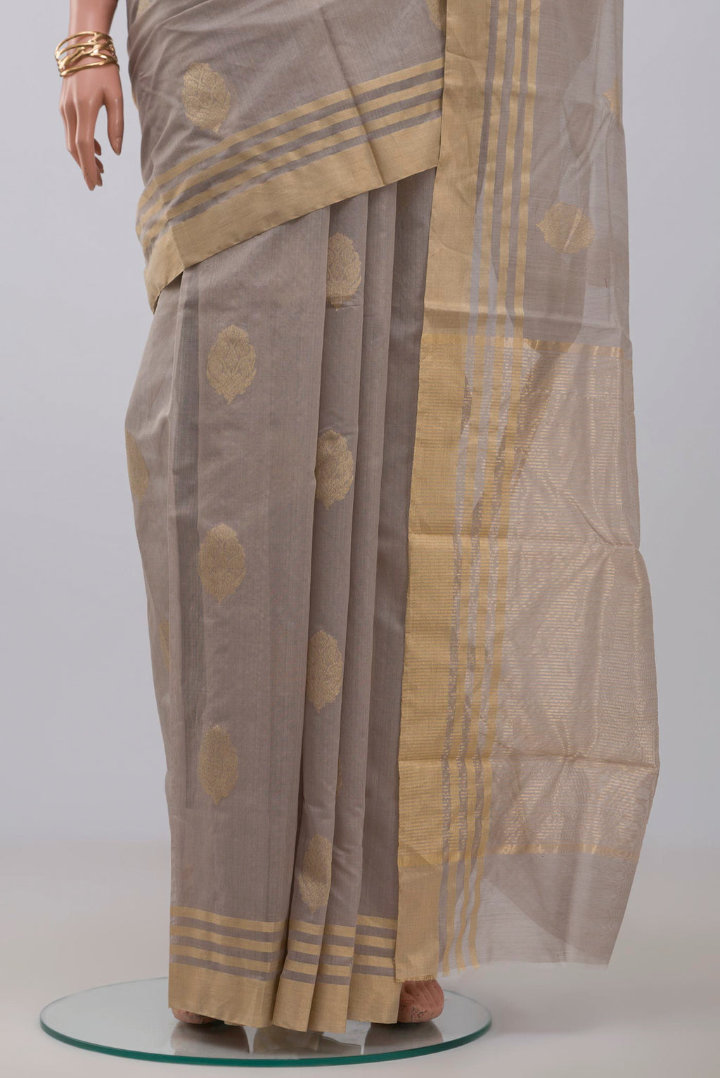 Pleats and pallu of Grey Chanderi Silk Cotton Saree with Zari Butta on the body and Zari Border. 