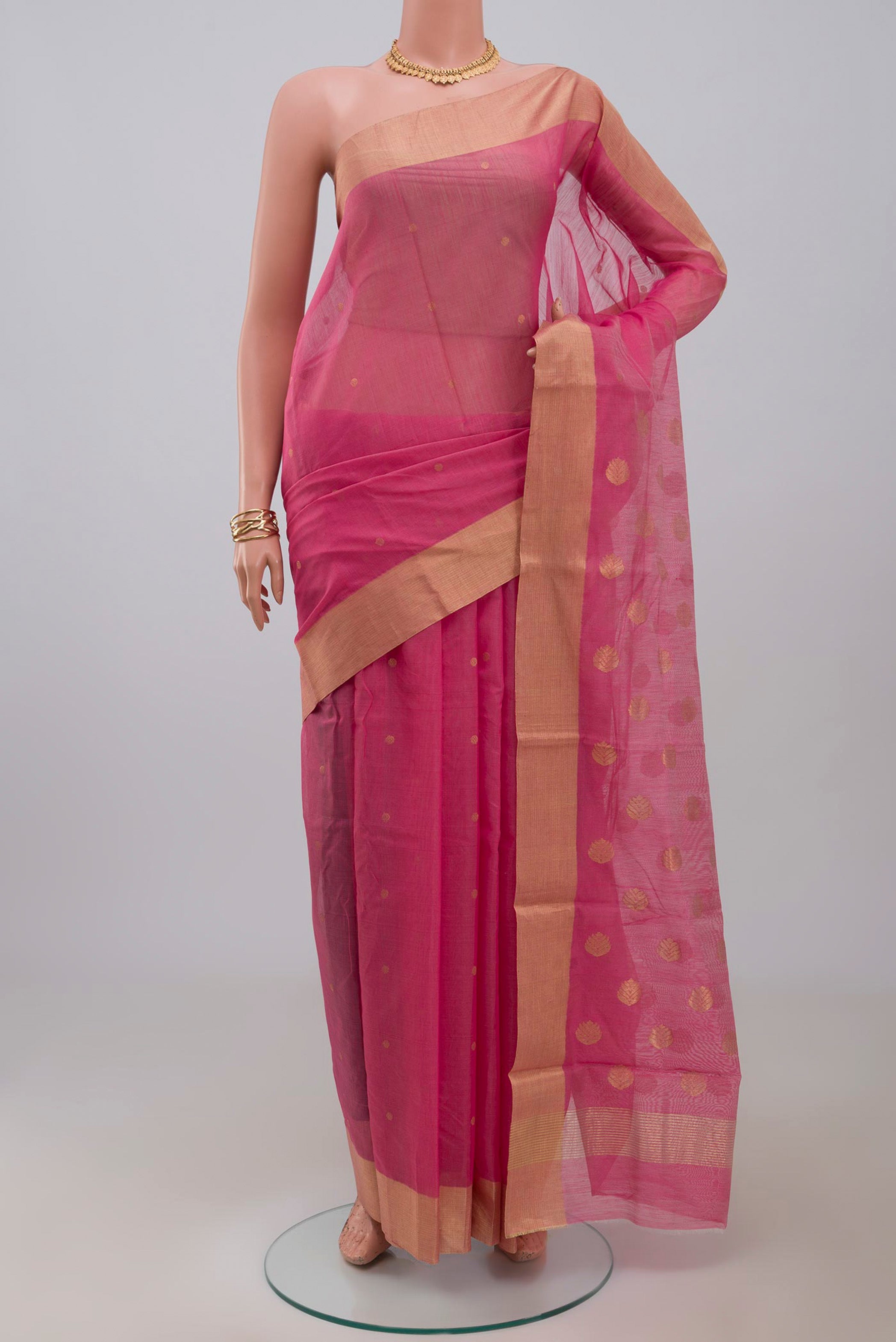 Pink Chanderi Silk Cotton Saree with Zari Butta on the body and Zari Border.  displayed on a mannequin