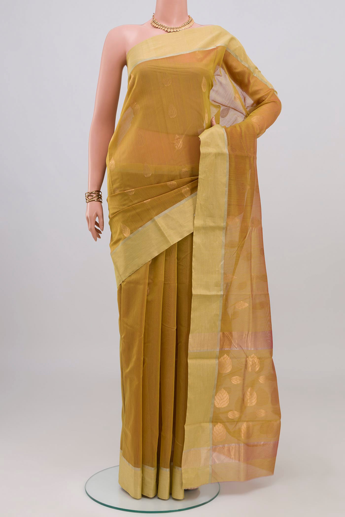 Lemon Yellow Chanderi Silk Cotton Saree with Zari Butta on the body and Zari Border.  displayed on a mannequin