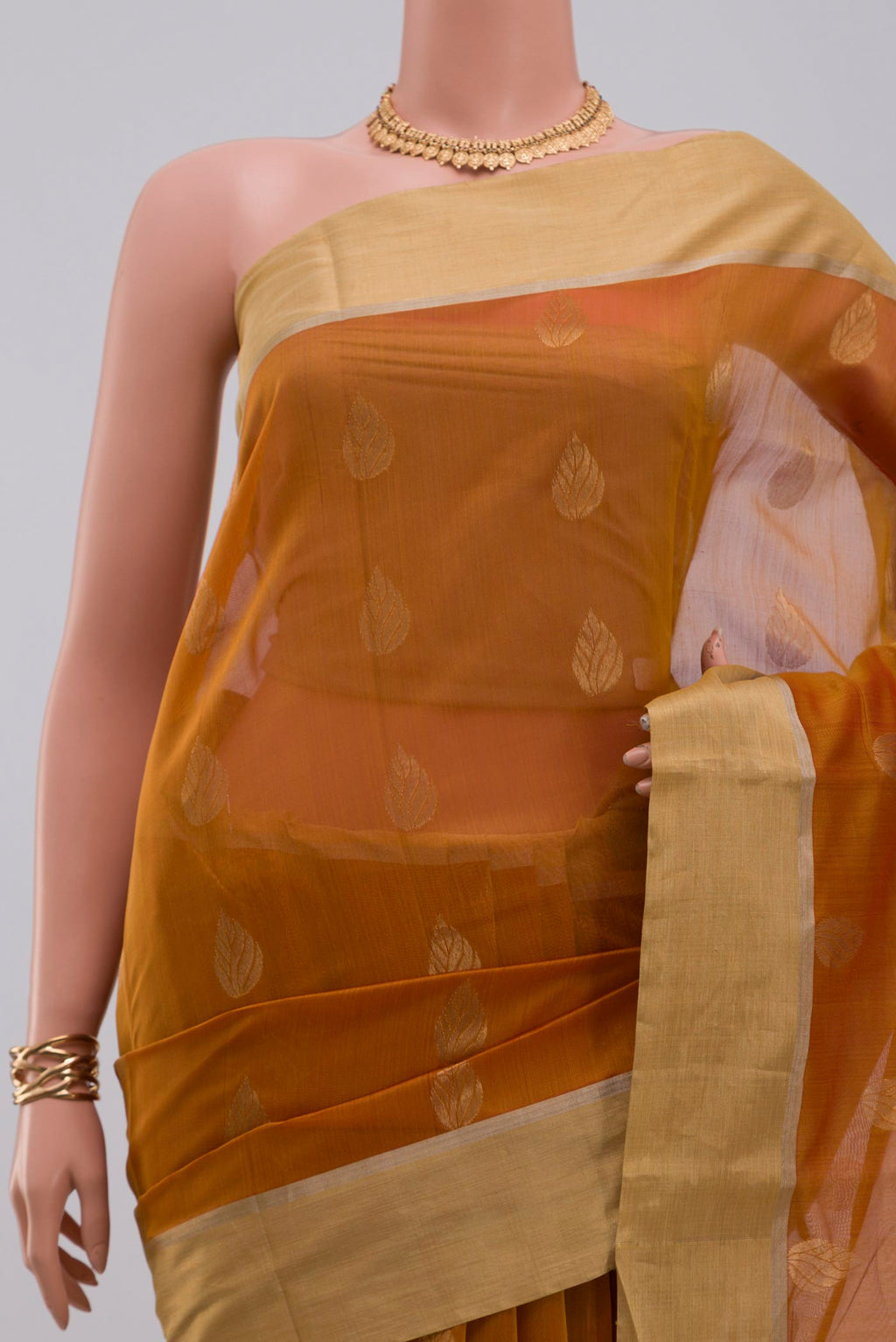 Border image of Mustard Chanderi Silk Cotton Saree with Zari Butta on the body and Zari Border. 