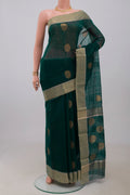Green Chanderi Silk Cotton Saree with Zari Butta on the body and Zari Border.  displayed on a mannequin