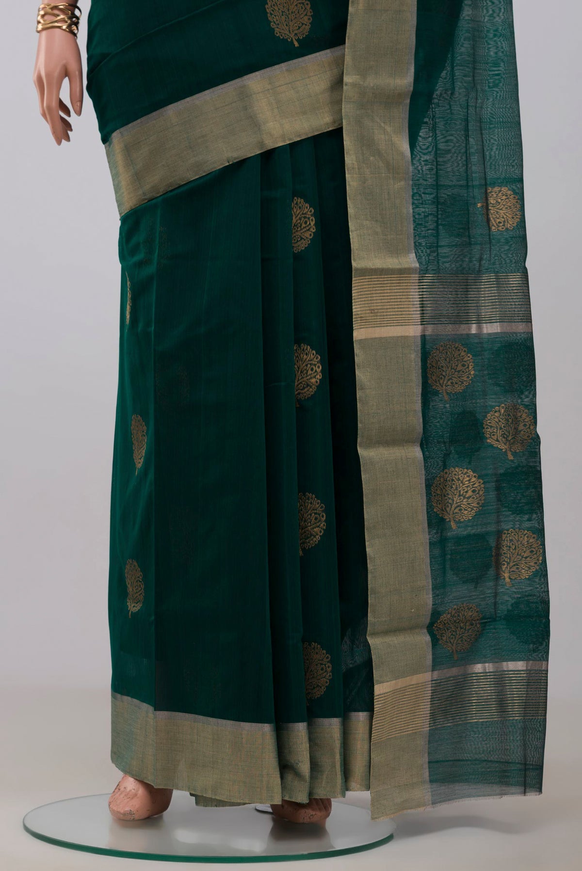 Pleats and pallu of Green Chanderi Silk Cotton Saree with Zari Butta on the body and Zari Border. 
