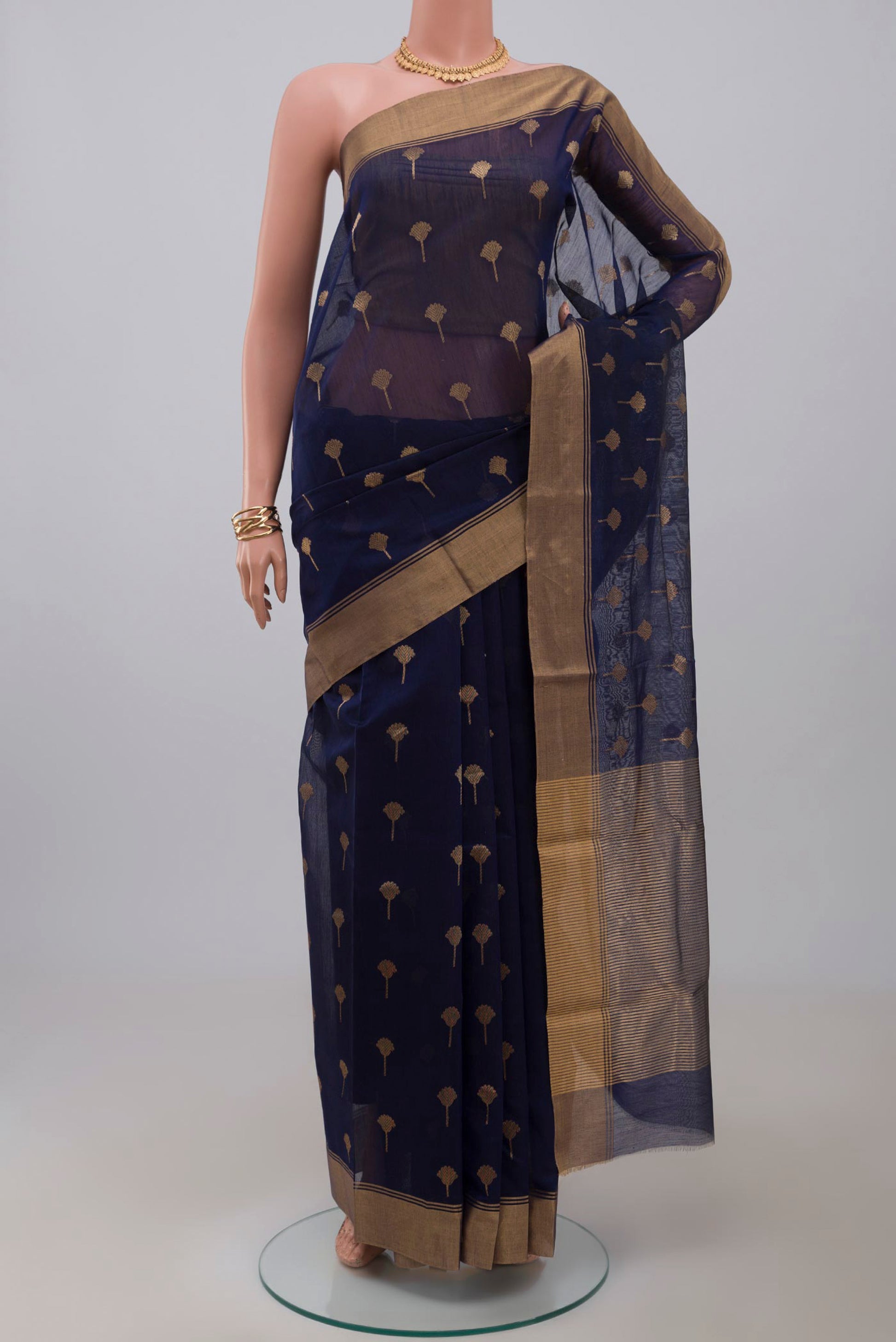 Navy Blue Chanderi Silk Cotton Saree with Zari Butta on the body and Zari Border.  displayed on a mannequin