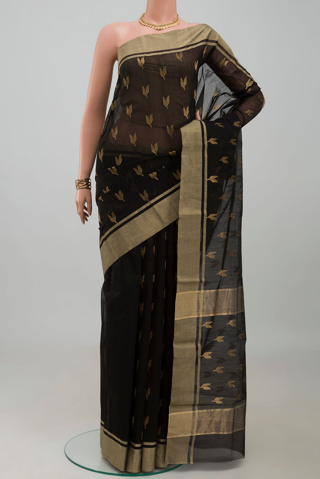 Black Chanderi Silk Cotton Saree with Zari Butta on the body and Zari Border.  displayed on a mannequin