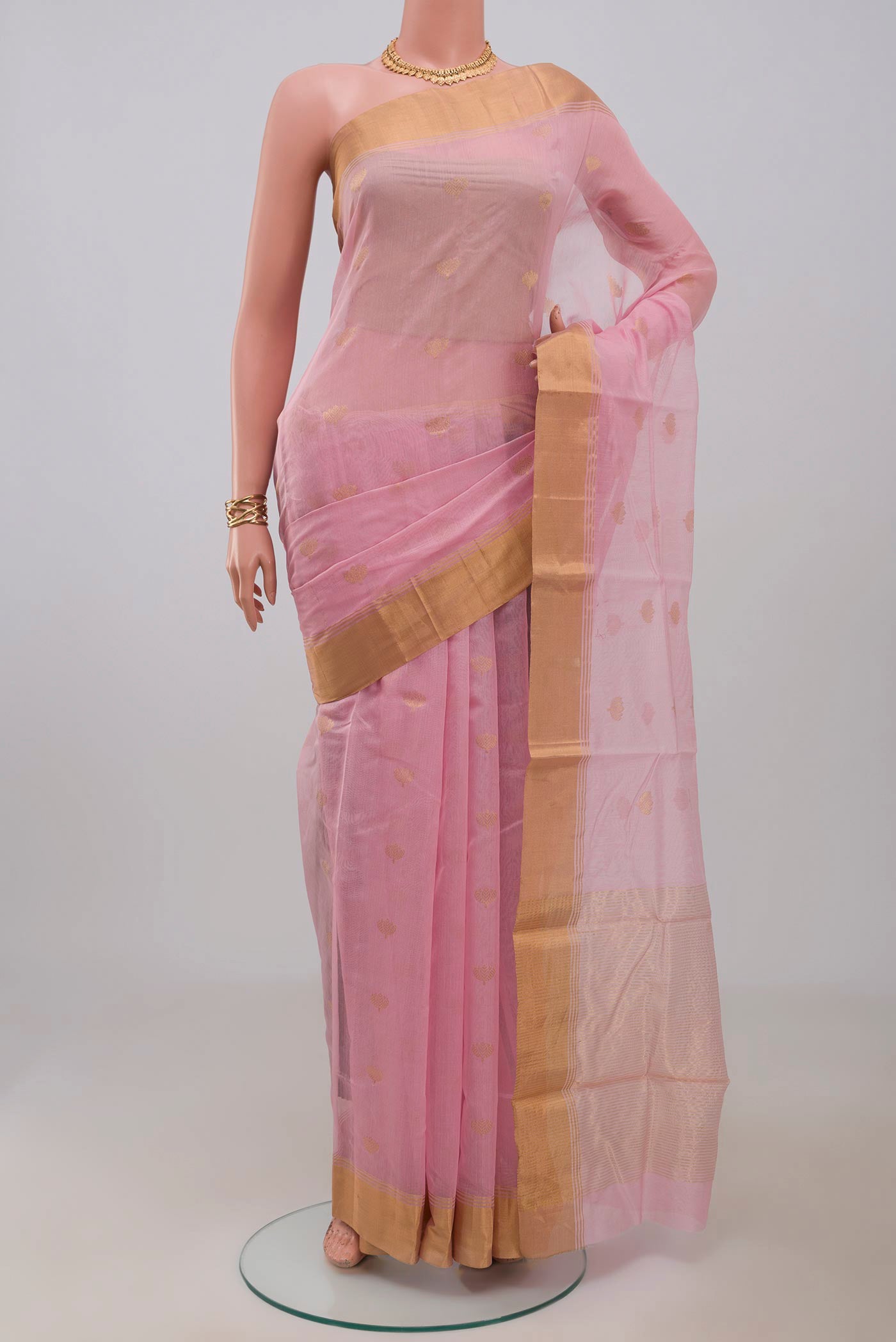 Pink Chanderi Silk Cotton Saree with Zari Butta on the body and Zari Border.  displayed on a mannequin