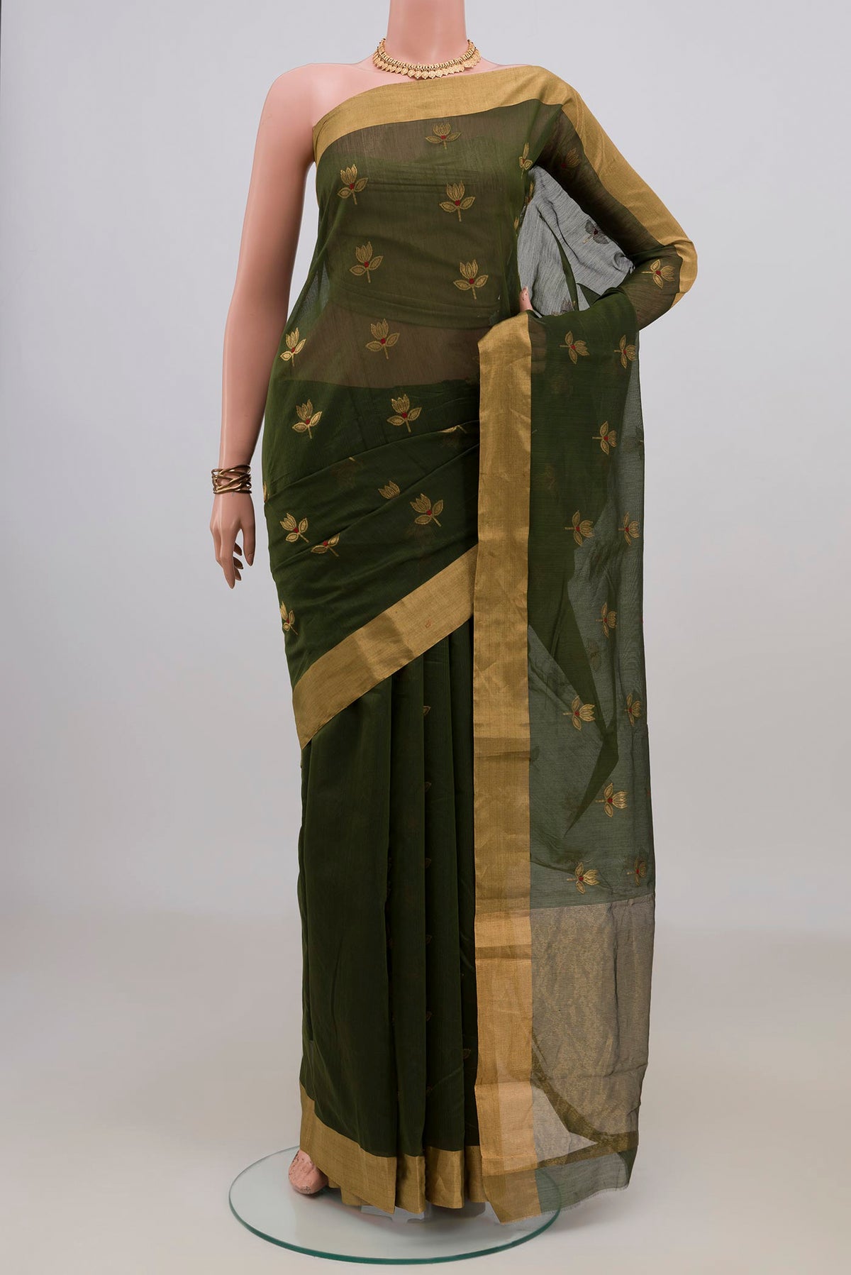 Mehandi Green Chanderi Cotton Saree with Zari Butta on the body and Zari Border.  displayed on a mannequin