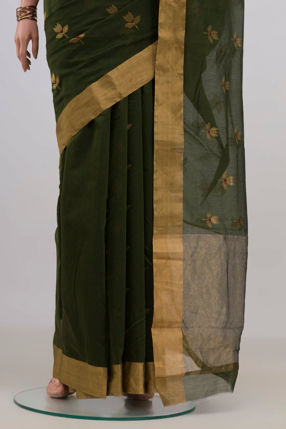 Pleats and pallu of Mehandi Green Chanderi Cotton Saree with Zari Butta on the body and Zari Border. 
