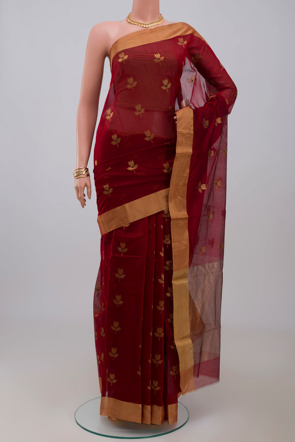 Red Chanderi Silk Cotton Saree with Zari Butta on the body and Zari Border.  displayed on a mannequin