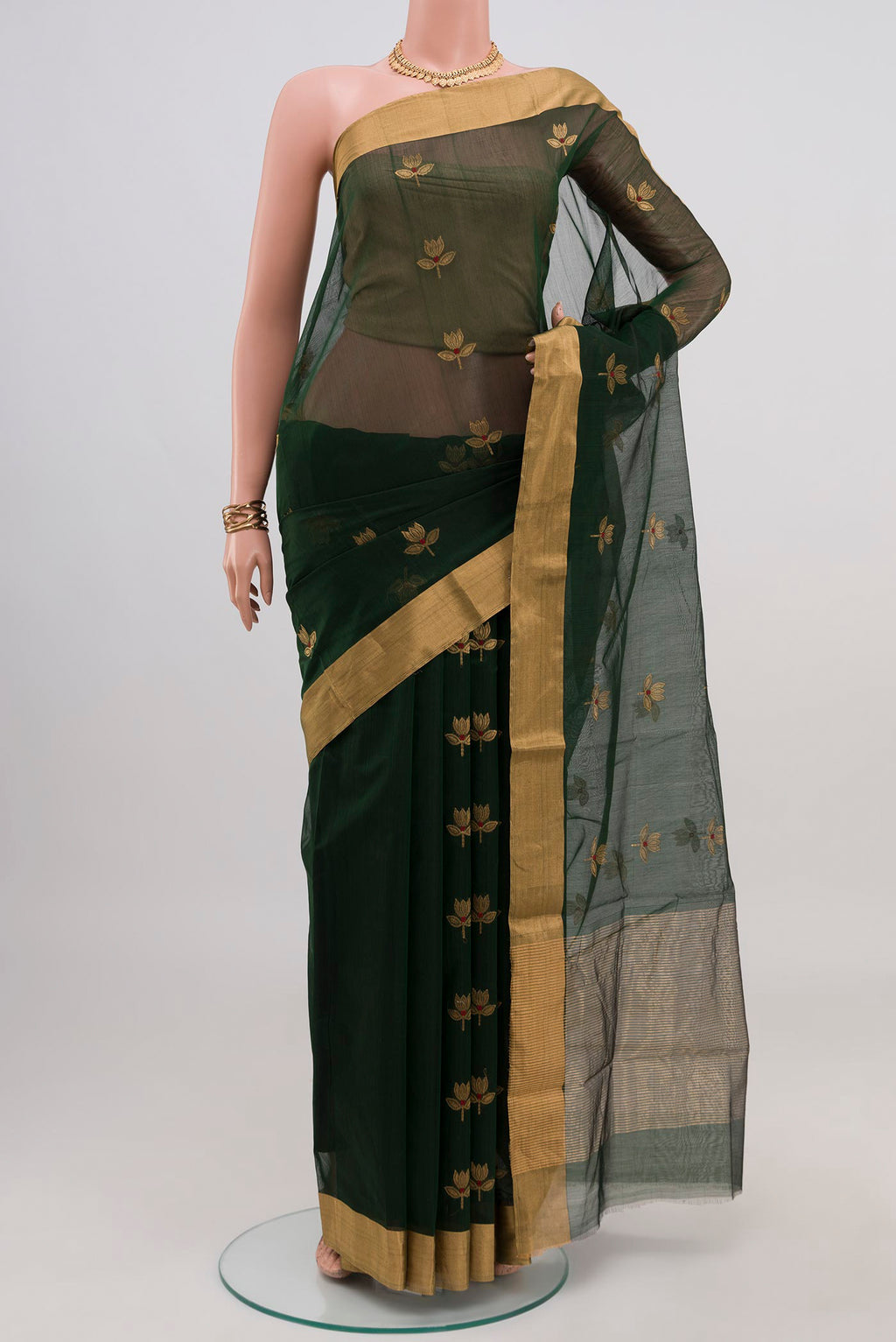 Green Chanderi Silk Cotton Saree with Zari Butta on the body and Zari Border.  displayed on a mannequin