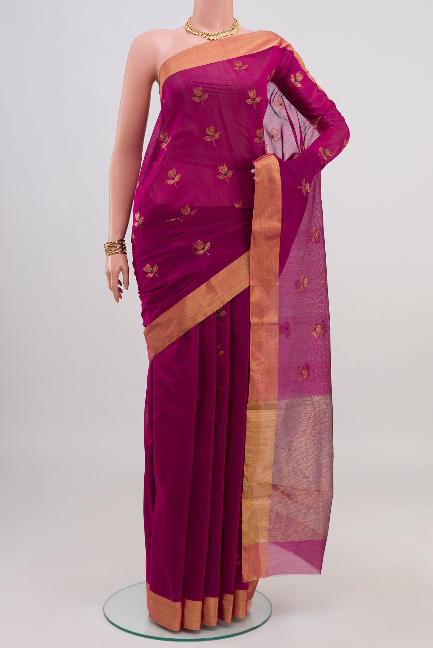 Pink Chanderi Silk Cotton Saree with Zari Butta on the body and Zari Border.  displayed on a mannequin
