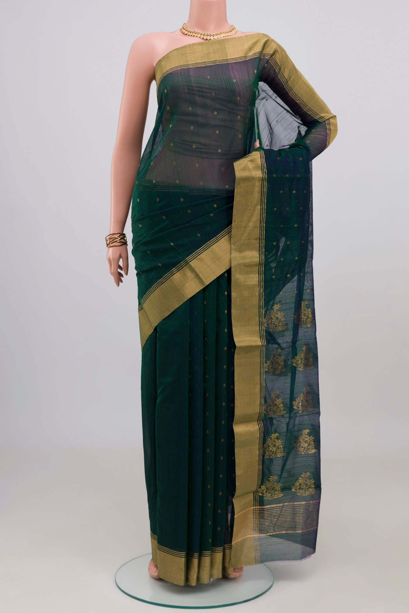 Green Dual Tone Chanderi Silk Cotton Saree with Zari Butta on the body and Zari Border.  displayed on a mannequin