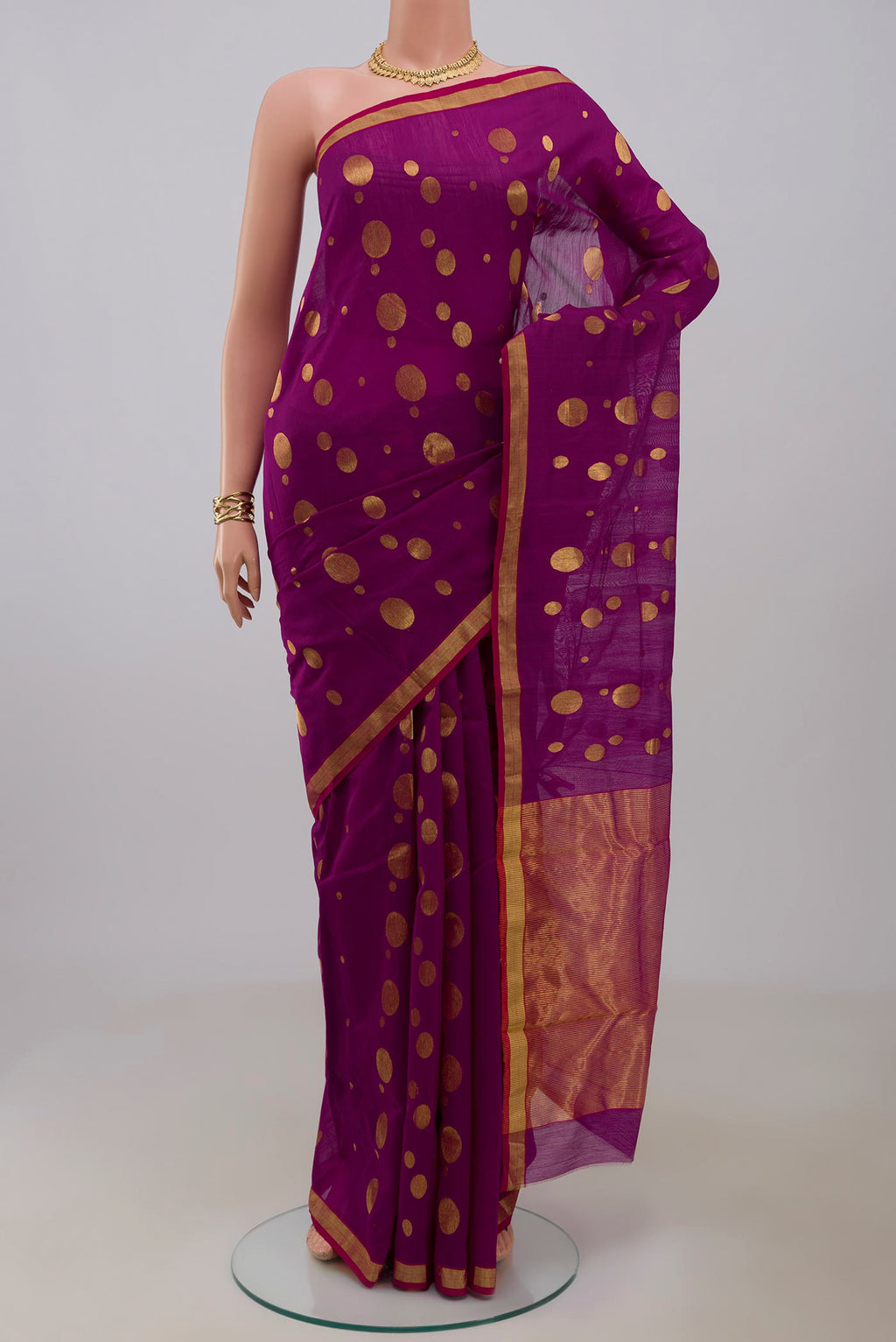 Magenta Chanderi Silk Cotton Saree with Zari Butta on the body and Zari Border.  displayed on a mannequin