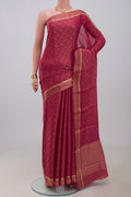 Pink Georgette Saree with Fancy on the body and Fancy Border.  displayed on a mannequin