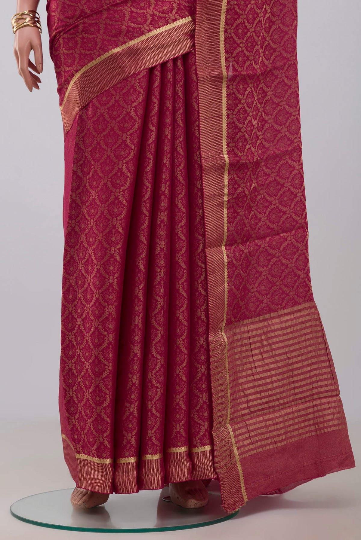 Pleats and pallu of Pink Georgette Saree with Fancy on the body and Fancy Border. 