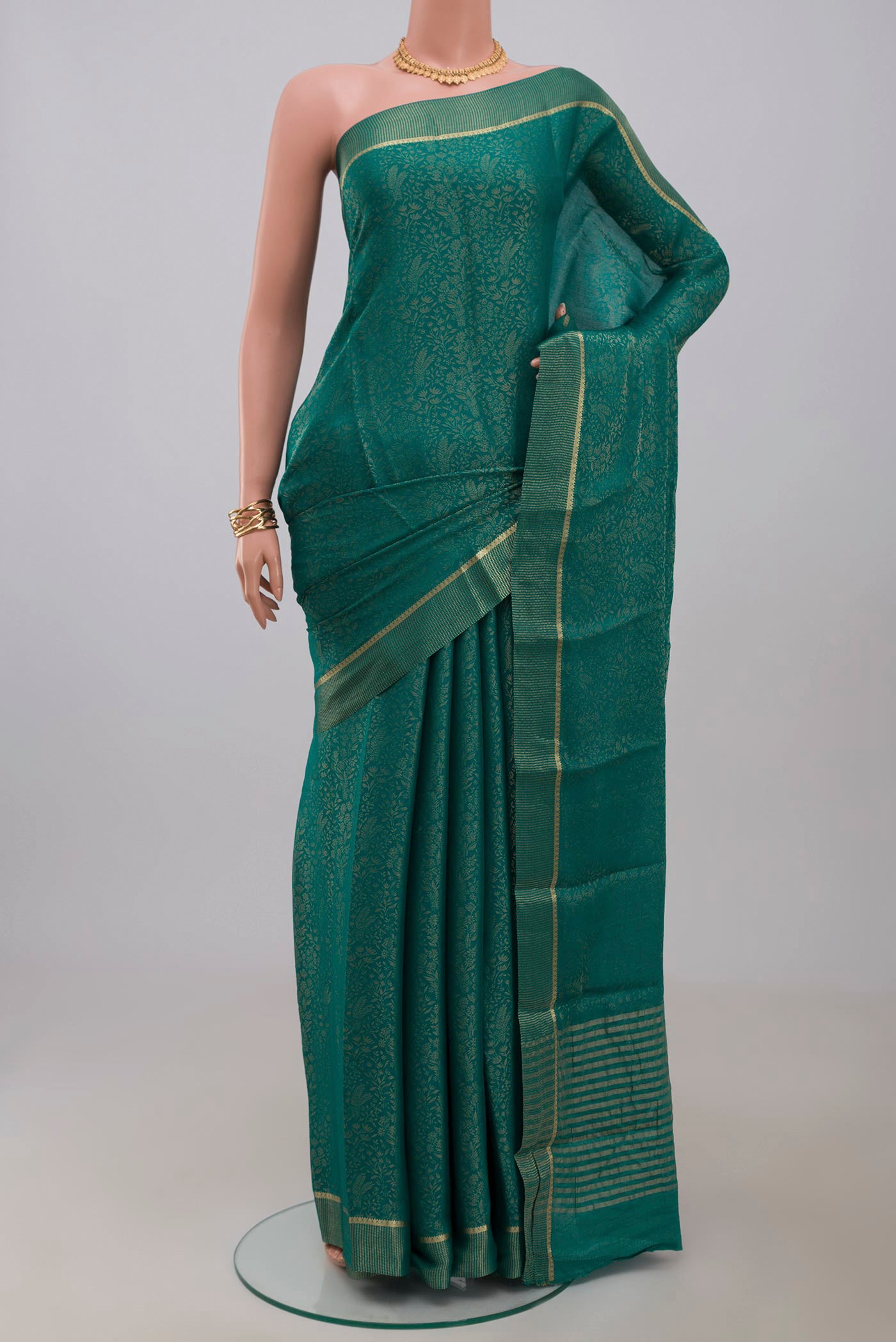 Blue Georgette Saree with Fancy on the body and Fancy Border.  displayed on a mannequin