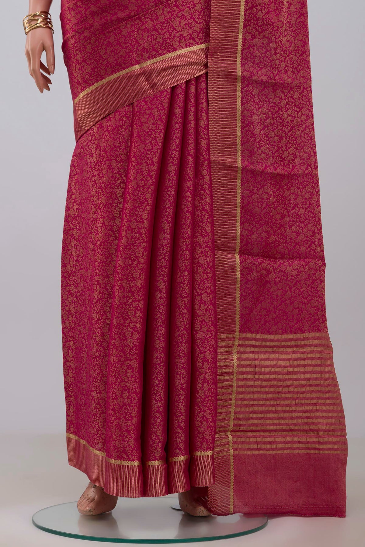 Pleats and pallu of Pink Georgette Saree with Fancy on the body and Fancy Border. 
