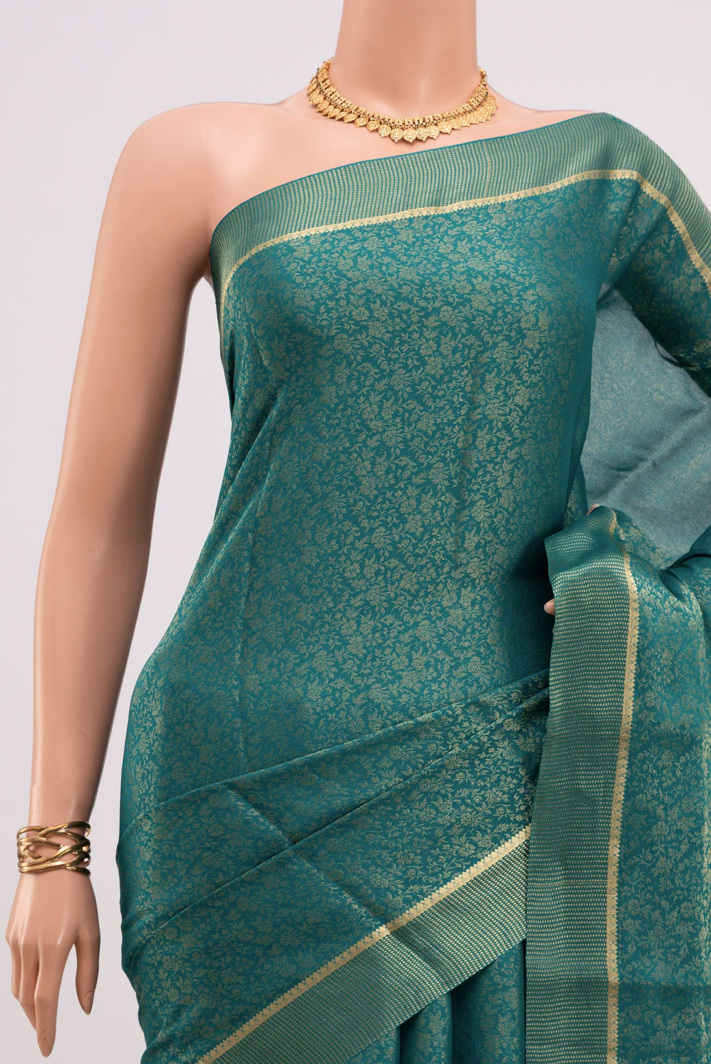 Border image of Peacock Blue Mysore Georgette Saree with Fancy on the body and Zari Border. 