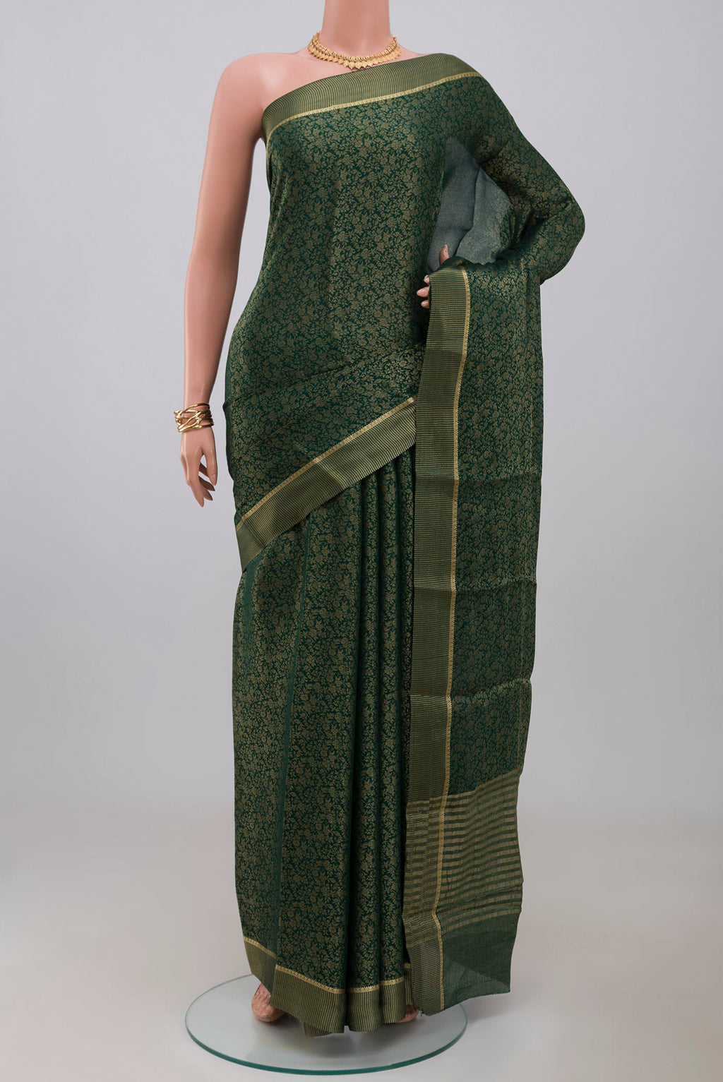 Green Mysore Georgette Saree with Fancy on the body and Fancy Border.  displayed on a mannequin