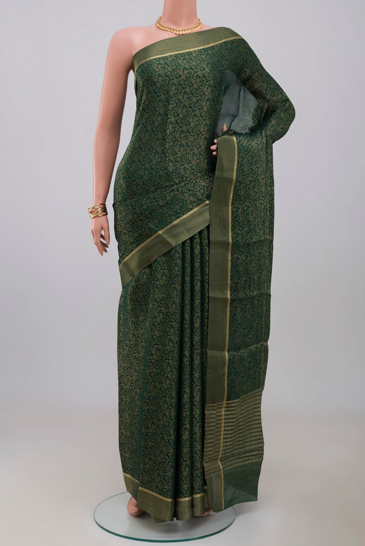 Green Mysore Georgette Saree with Fancy on the body and Fancy Border.  displayed on a mannequin