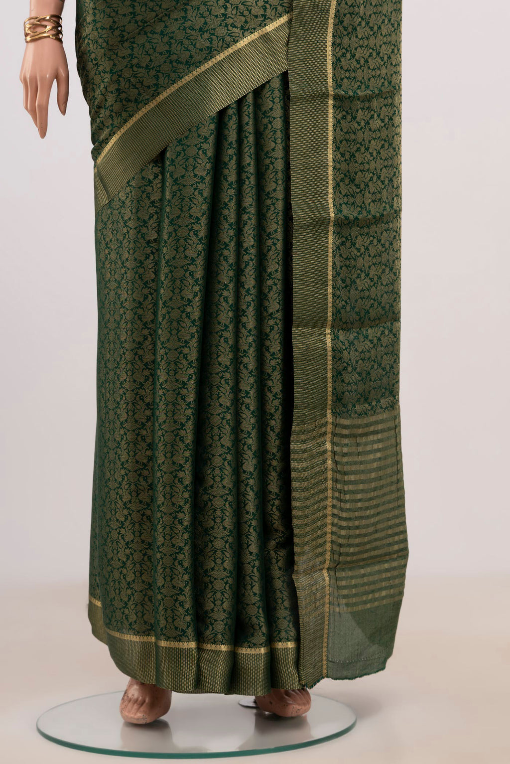 Pleats and pallu of Green Mysore Georgette Saree with Fancy on the body and Zari Border. 