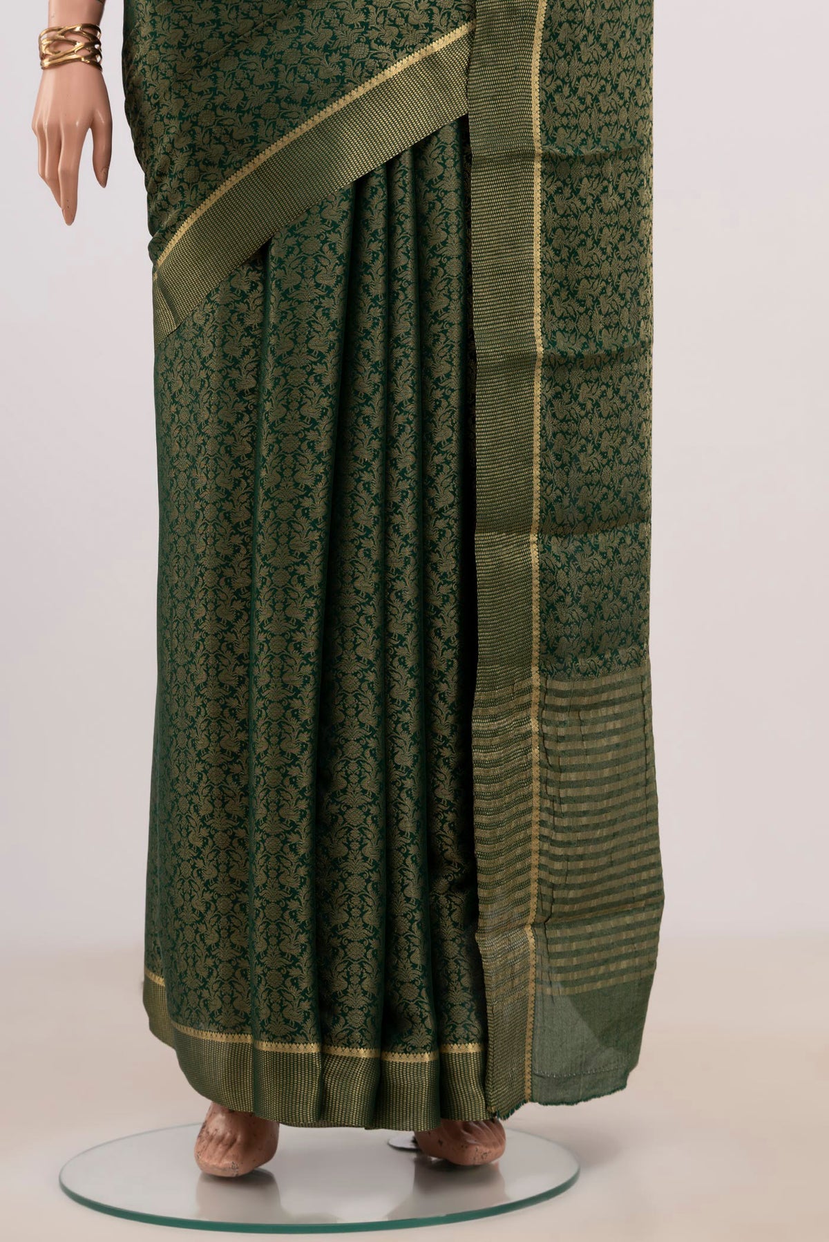 Pleats and pallu of Green Mysore Georgette Saree with Fancy on the body and Zari Border. 