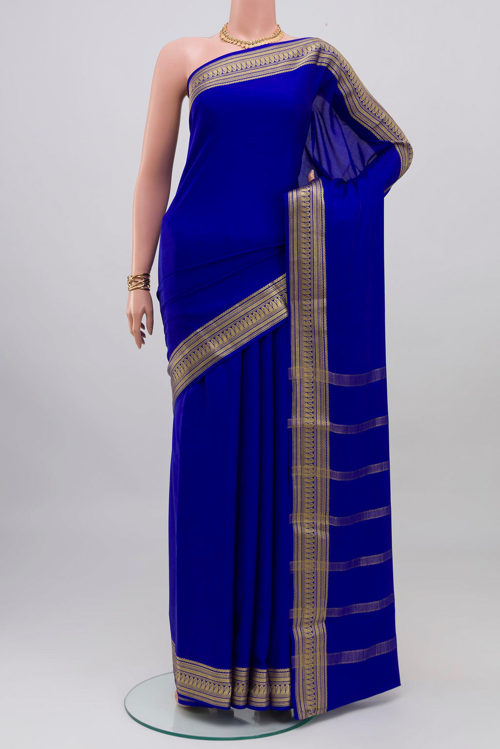 Royal Blue Mysore Crepe Saree with Plain Body and Zari Border.  displayed on a mannequin