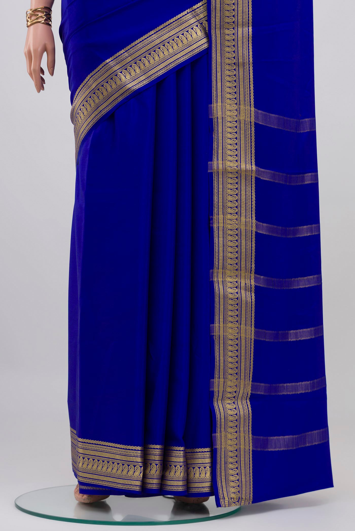 Pleats and pallu of Royal Blue Mysore Crepe Saree with Plain Body and Zari Border. 
