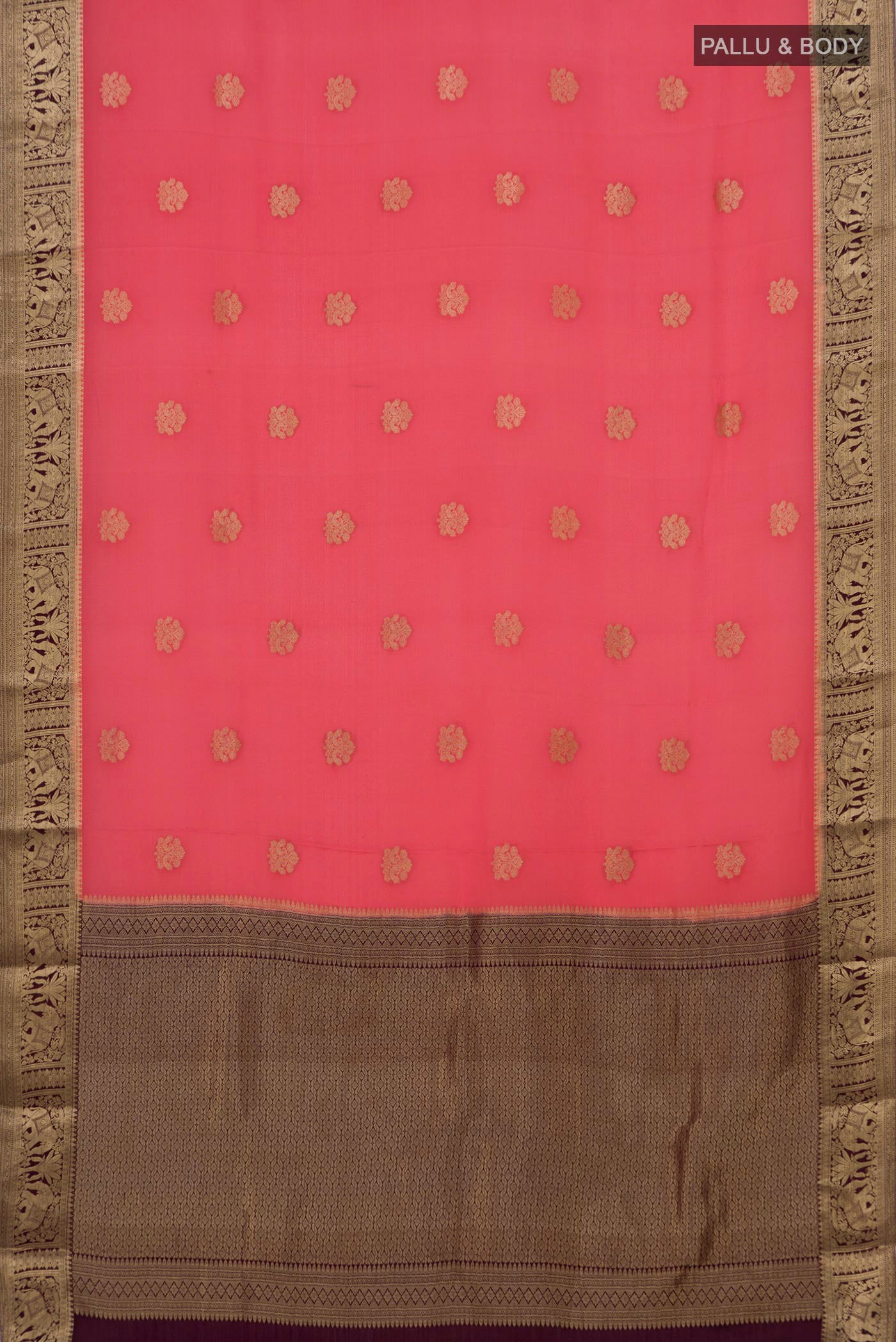 Flat view of Coral Mysore Crepe Saree with Zari Butta on the body and Zari Border. 