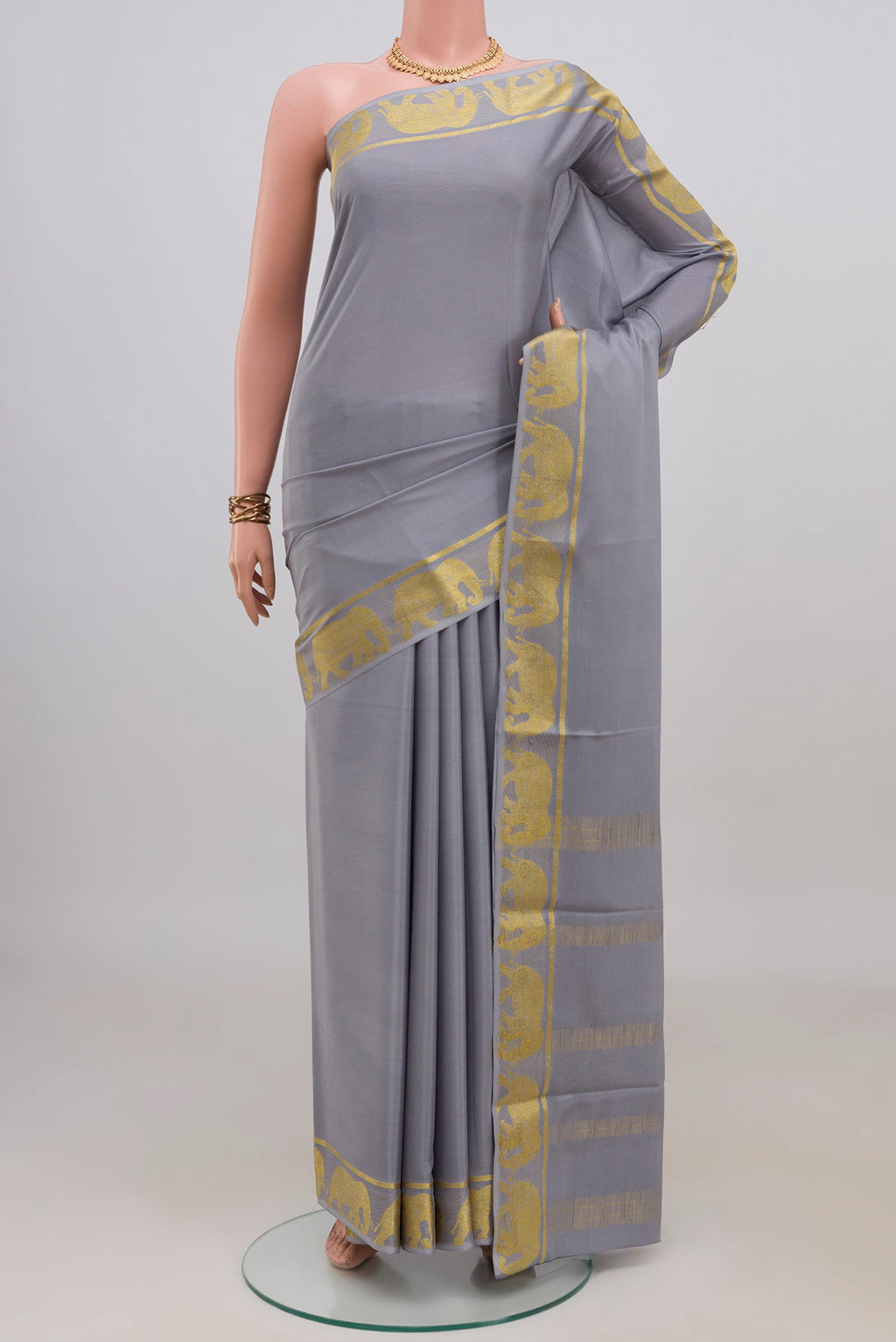 Grey Mysore Crepe Saree with Plain Body and Fancy Border.  displayed on a mannequin