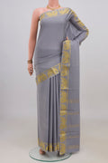Grey Mysore Crepe Saree with Plain Body and Fancy Border.  displayed on a mannequin