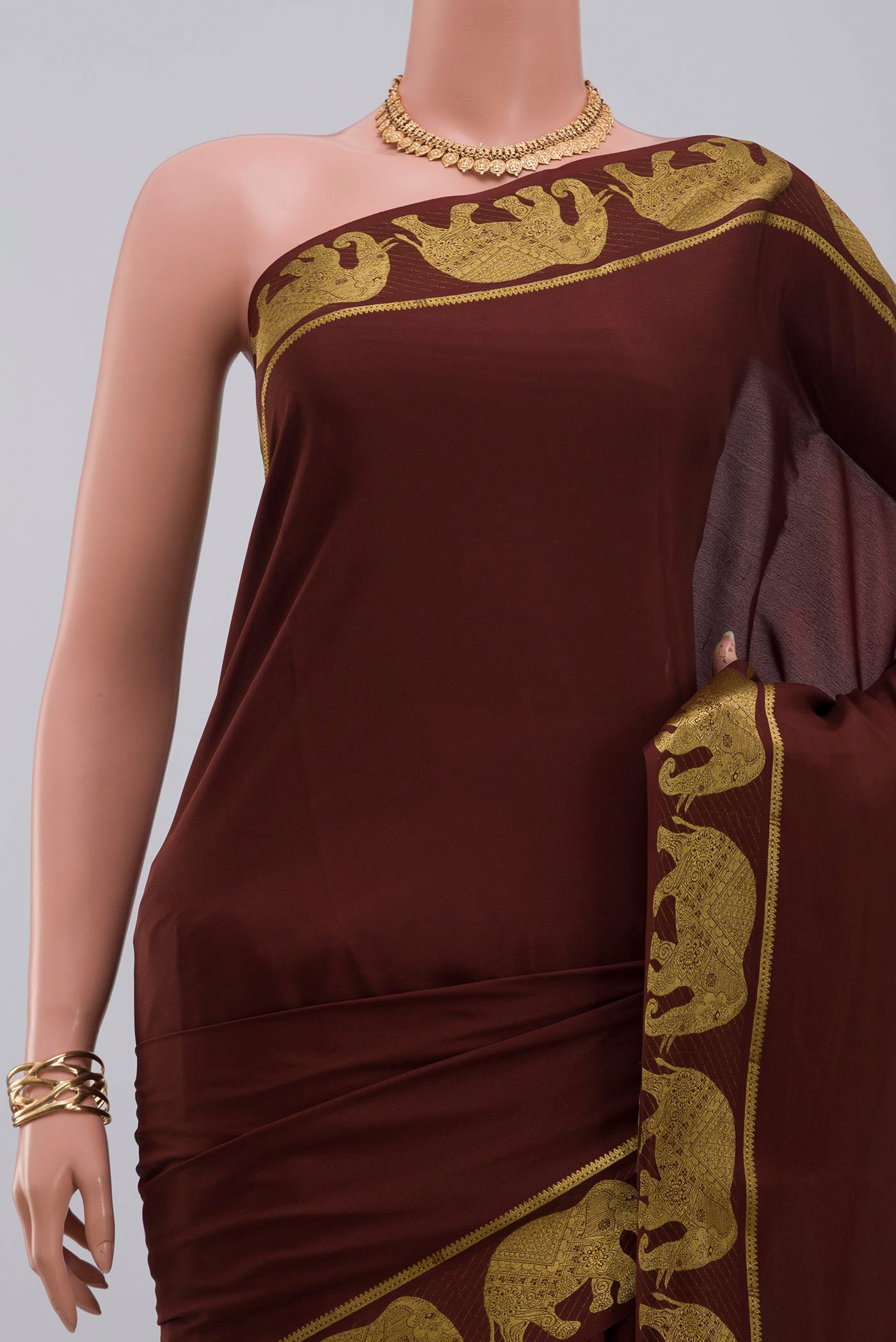 Border image of Brown Crepe Saree with Plain Body and Fancy Border. 