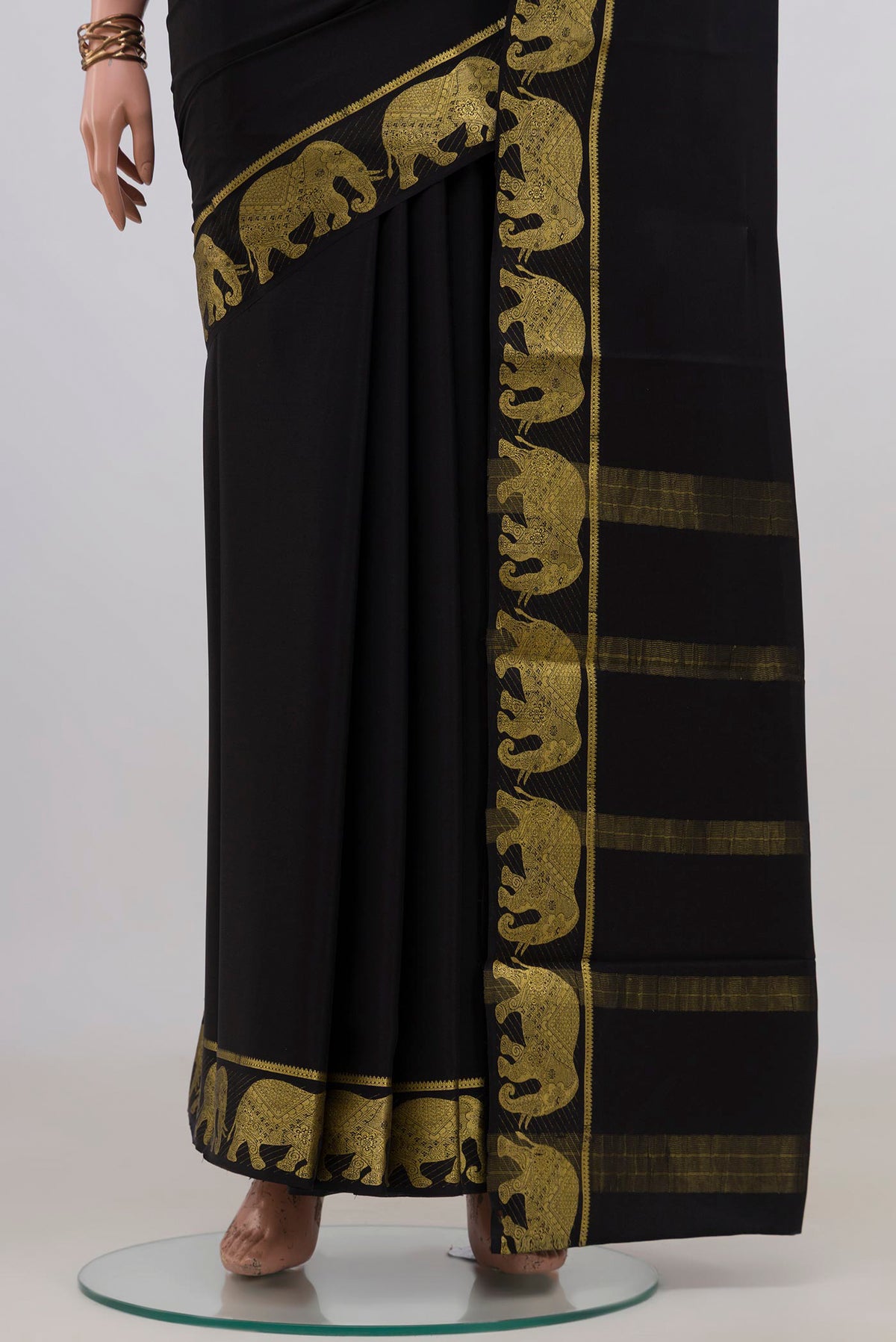 Pleats and pallu of Black Mysore Crepe Saree with Plain Body and Fancy Border. 