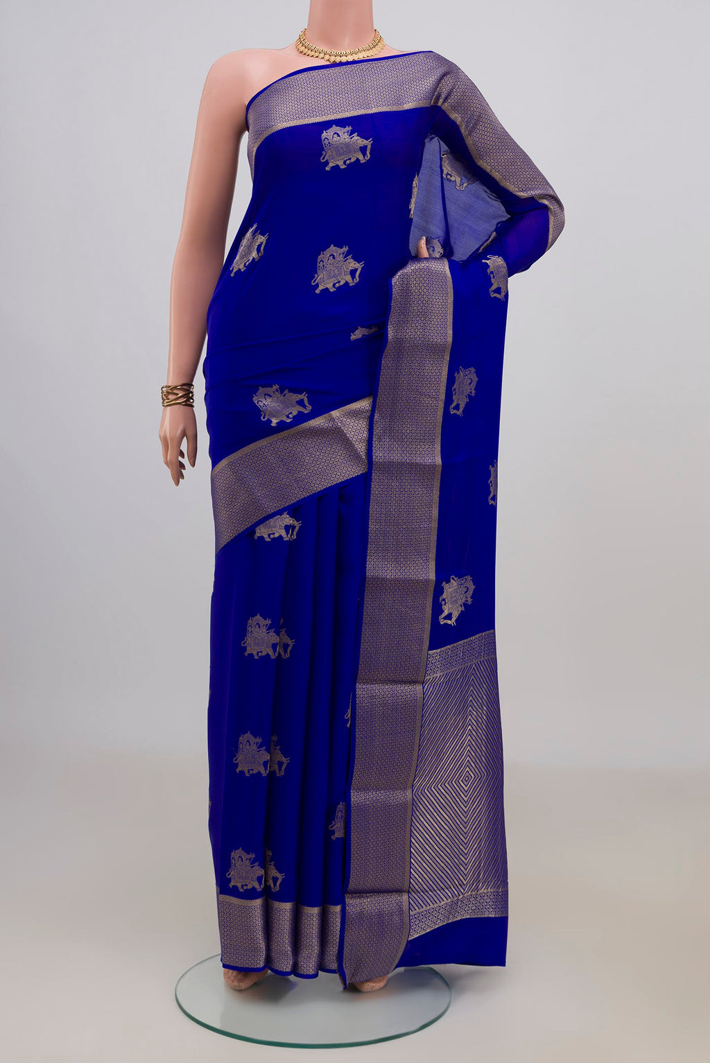Royal Blue Mysore Crepe Saree with Zari Butta on the body and Zari Border.  displayed on a mannequin