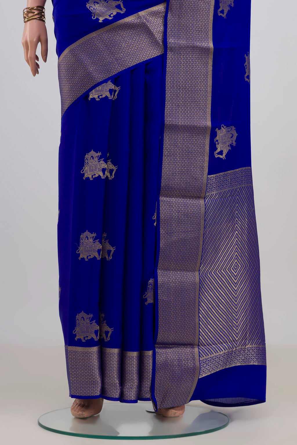 Pleats and pallu of Royal Blue Mysore Crepe Saree with Zari Butta on the body and Zari Border. 
